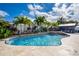 Freeform pool and spa with flagstone decking at 831 Evergreen St, New Smyrna Beach, FL 32169