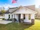 Exterior view of craftsman style home with stone accents and a flag at 997 Sugar Mill Dr, New Smyrna Beach, FL 32168