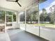 Relaxing screened porch overlooking backyard at 997 Sugar Mill Dr, New Smyrna Beach, FL 32168