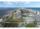 Wide aerial showcasing oceanfront condo complex and surrounding area at 1 Oceans West Blvd # 5A3, Daytona Beach, FL 32118