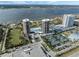 Aerial view of two condo towers, pool, tennis courts, and parking at 1 Oceans West Blvd # 5A3, Daytona Beach, FL 32118