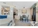 Kitchen and dining area with modern appliances and breakfast bar at 1 Oceans West Blvd # 5A3, Daytona Beach, FL 32118