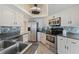 Well-equipped kitchen featuring stainless steel appliances and tile backsplash at 1 Oceans West Blvd # 5A3, Daytona Beach, FL 32118