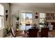 Bright dining area with glass table and chairs, overlooking backyard at 1002 Chelan Falls Dr, Deland, FL 32724