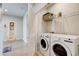 Laundry room with washer, dryer, and additional shelving at 1002 Chelan Falls Dr, Deland, FL 32724