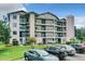 Condo building exterior with parking and landscaping at 1036 Bonaire Dr # 2832, Altamonte Springs, FL 32714