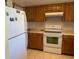 Kitchen with wood cabinets and appliances at 1036 Bonaire Dr # 2832, Altamonte Springs, FL 32714