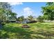 Fire pit in expansive grassy backyard at 12 Foster Dr, Daytona Beach, FL 32118