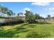 Large backyard with wood fence and lawn at 12 Foster Dr, Daytona Beach, FL 32118