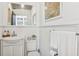 Small, clean bathroom with white vanity and toilet at 12 Foster Dr, Daytona Beach, FL 32118