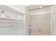 Pink tiled bathroom with shower/tub combo and built-in shelving at 12 Foster Dr, Daytona Beach, FL 32118