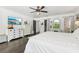 Spacious bedroom with dark hardwood floors, white bedding and walk-in closet at 12 Foster Dr, Daytona Beach, FL 32118