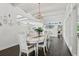 Bright dining room with white table and chairs, hardwood floors, and chandelier at 12 Foster Dr, Daytona Beach, FL 32118