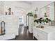 Entryway with white stonework, mirror, and console table at 12 Foster Dr, Daytona Beach, FL 32118