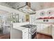 Modern kitchen with stainless steel appliances and a tin ceiling at 12 Foster Dr, Daytona Beach, FL 32118