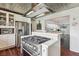 Stainless steel range, white cabinets and a view into the dining room at 12 Foster Dr, Daytona Beach, FL 32118