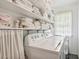 Laundry room with washer, dryer, and shelving for linens at 12 Foster Dr, Daytona Beach, FL 32118