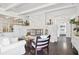 Living room with white walls, white sofas, and a fireplace at 12 Foster Dr, Daytona Beach, FL 32118