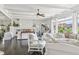 Living room with hardwood floors, white walls, and white sofas at 12 Foster Dr, Daytona Beach, FL 32118