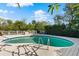 Enjoy this large kidney shaped pool and deck at 12 Foster Dr, Daytona Beach, FL 32118