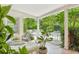 Relaxing pool area with patio furniture under a covered porch at 12 Foster Dr, Daytona Beach, FL 32118