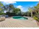 Inviting kidney-shaped pool with a large deck at 12 Foster Dr, Daytona Beach, FL 32118