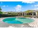 Stunning kidney-shaped pool with spacious deck at 12 Foster Dr, Daytona Beach, FL 32118