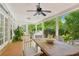 Screened porch with wooden table and chairs, overlooking pool at 12 Foster Dr, Daytona Beach, FL 32118