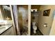 Bathroom boasts a walk-in shower, pebble floor, and updated vanity at 1202 12Th St, Edgewater, FL 32132