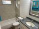 Updated bathroom with a bathtub, shower, modern sink and vanity at 1202 12Th St, Edgewater, FL 32132