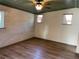 Simple, unfurnished bedroom featuring light hardwood floors, light-colored walls and a decorative ceiling at 1202 12Th St, Edgewater, FL 32132