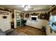 Bedroom with hardwood floors, a ceiling fan, and decorative accents at 1202 12Th St, Edgewater, FL 32132