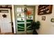 Unique closet with whimsical green doors and nature-themed cutouts at 1202 12Th St, Edgewater, FL 32132