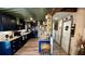 View of a kitchen with dark blue cabinetry, granite countertops, and an island at 1202 12Th St, Edgewater, FL 32132