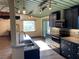 Well-lit kitchen featuring blue cabinets, stainless steel appliances, and an open floor plan at 1202 12Th St, Edgewater, FL 32132