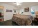 King bedroom with dark tile floors and large windows at 1207 Magnolia St, New Smyrna Beach, FL 32168