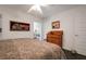 King-size bed in spacious bedroom with dark tile floors at 1207 Magnolia St, New Smyrna Beach, FL 32168