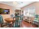 Dining room with round table and teal chairs at 1207 Magnolia St, New Smyrna Beach, FL 32168