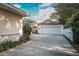 Attached garage with white door and concrete driveway at 1207 Magnolia St, New Smyrna Beach, FL 32168