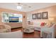 Bright living room with comfy seating and hardwood floors at 1207 Magnolia St, New Smyrna Beach, FL 32168