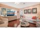 Living room with sofa and hardwood floors at 1207 Magnolia St, New Smyrna Beach, FL 32168