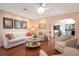 Living room with sofa and hardwood floors at 1207 Magnolia St, New Smyrna Beach, FL 32168