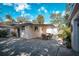 Cozy patio area with table and chairs, adjacent to the house at 1207 Magnolia St, New Smyrna Beach, FL 32168