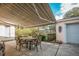 Covered patio with dining table and chairs at 1207 Magnolia St, New Smyrna Beach, FL 32168