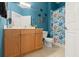 Bathroom with wood vanity, shower, and nautical theme at 121 Sedona Cir, Daytona Beach, FL 32124