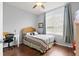 Guest bedroom with wood floors and plenty of natural light at 121 Sedona Cir, Daytona Beach, FL 32124