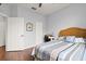 Cozy guest bedroom with wood floors and built-in workspace at 121 Sedona Cir, Daytona Beach, FL 32124