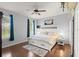 Main bedroom with wood floors, large bed, and plenty of natural light at 121 Sedona Cir, Daytona Beach, FL 32124