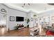 Spacious living room featuring hardwood floors and a large TV at 121 Sedona Cir, Daytona Beach, FL 32124