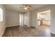 Living room with wood-look floors and ceiling fan at 1210 Washington St, New Smyrna Beach, FL 32168